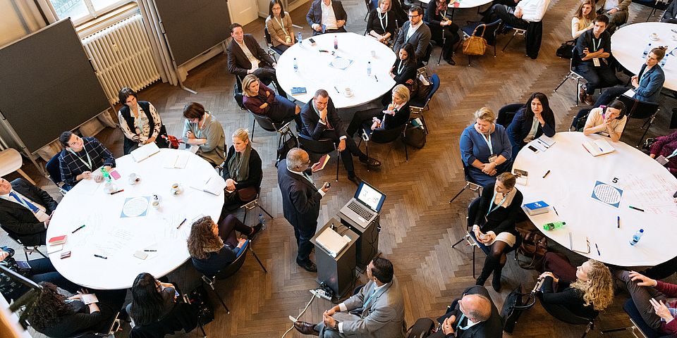 World Café - people discussing at tables