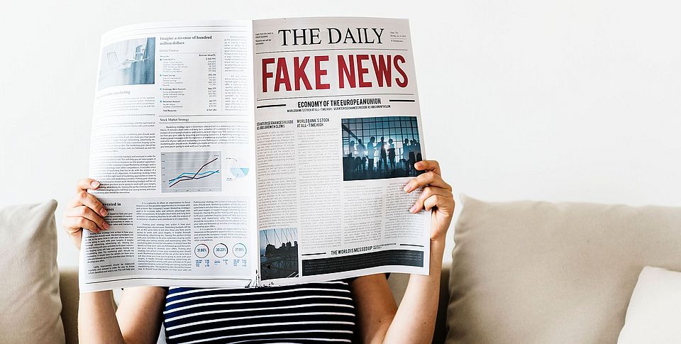 Woman reading newspaper