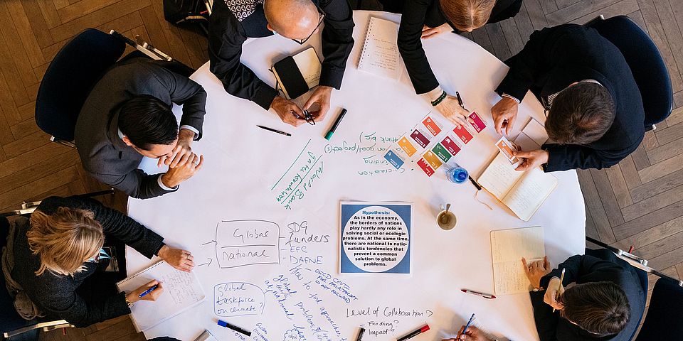 World Café - people discussing at tables